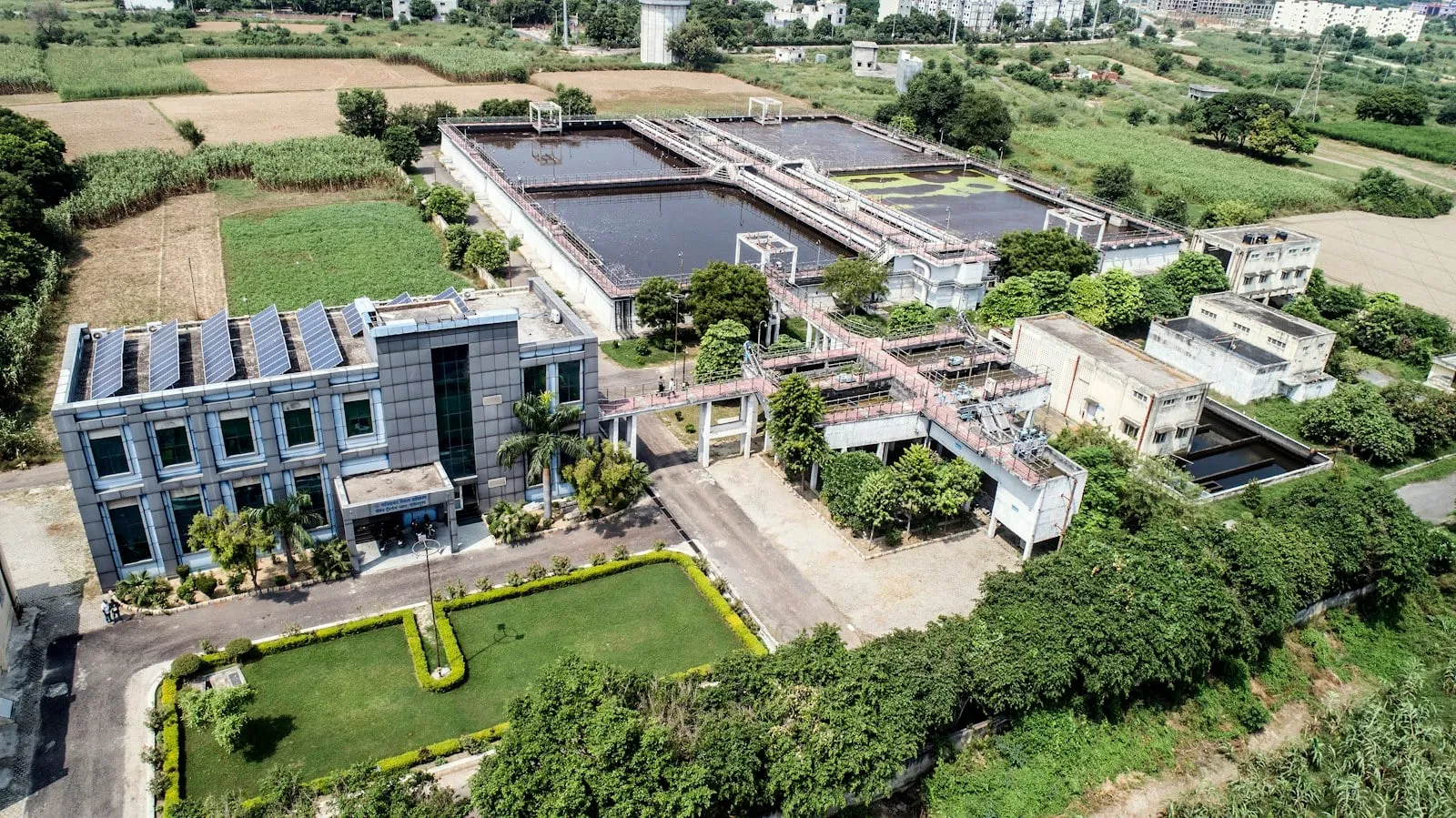 An aerial view of a water treatment plant and its clarifiers